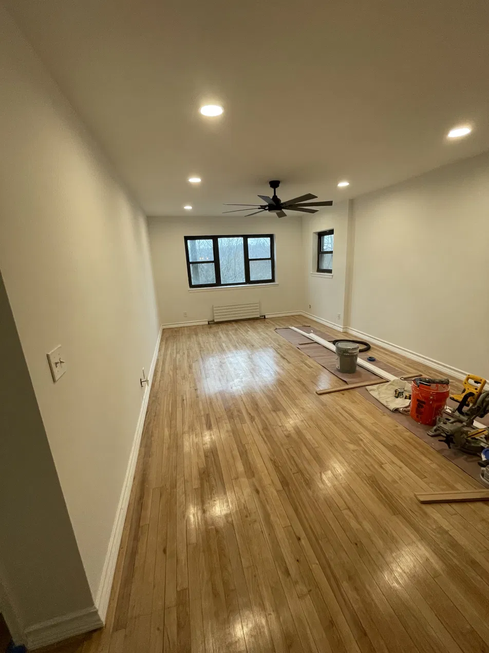 Before home renovation - dull floors, outdated finishes in Westchester NY home