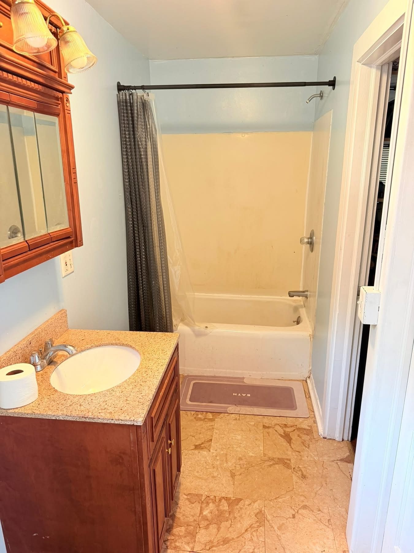 Before: outdated bathroom with old tub surround — Westchester NY