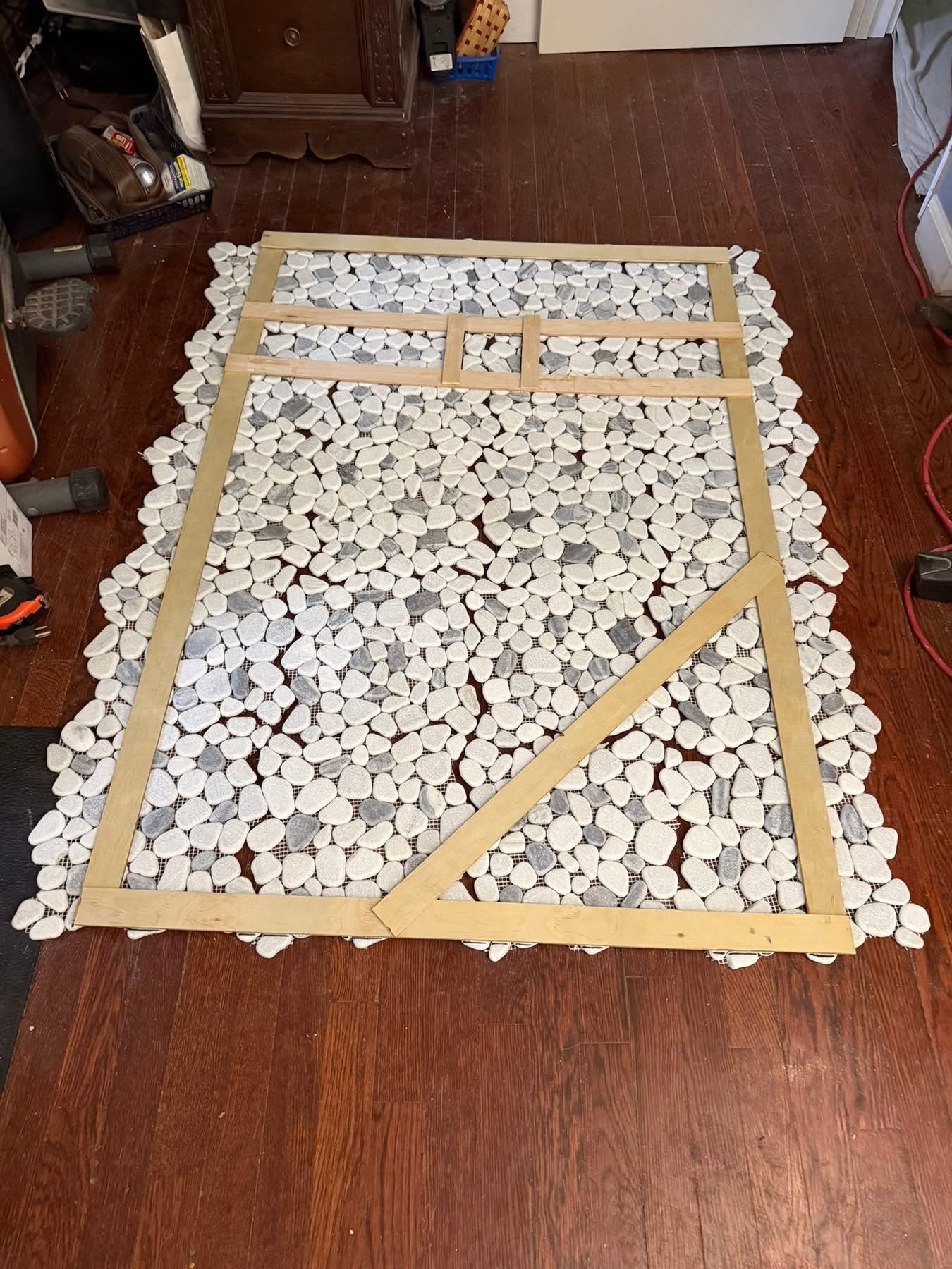 Pebble floor tile being set