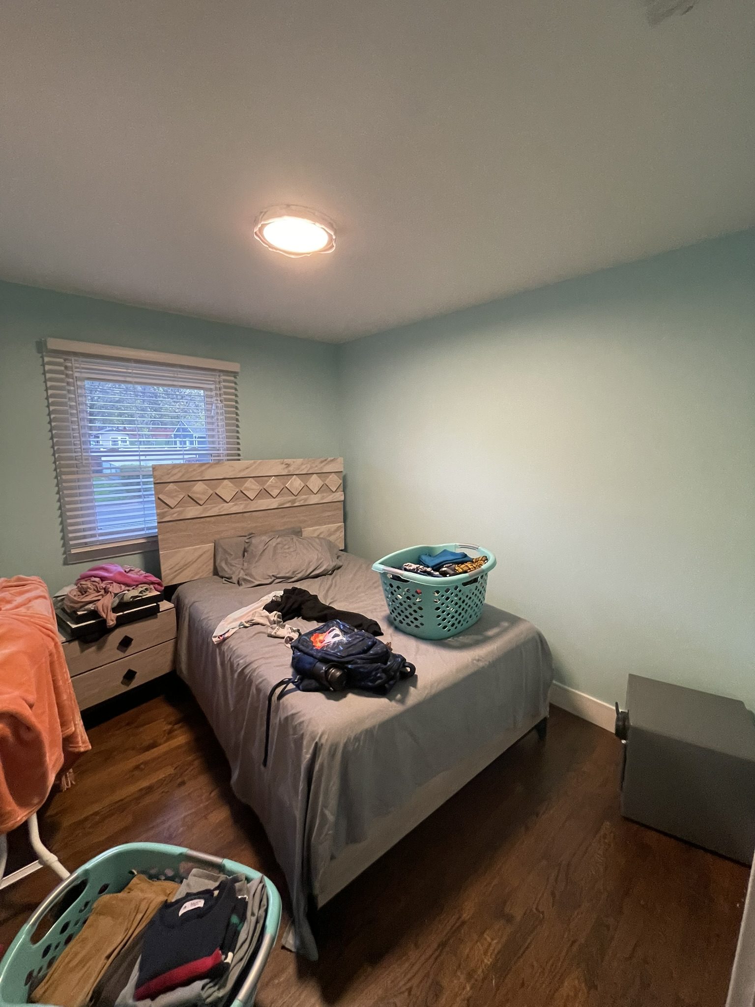 After: completed bedroom interior painting — fresh light teal-gray finish Westchester NY